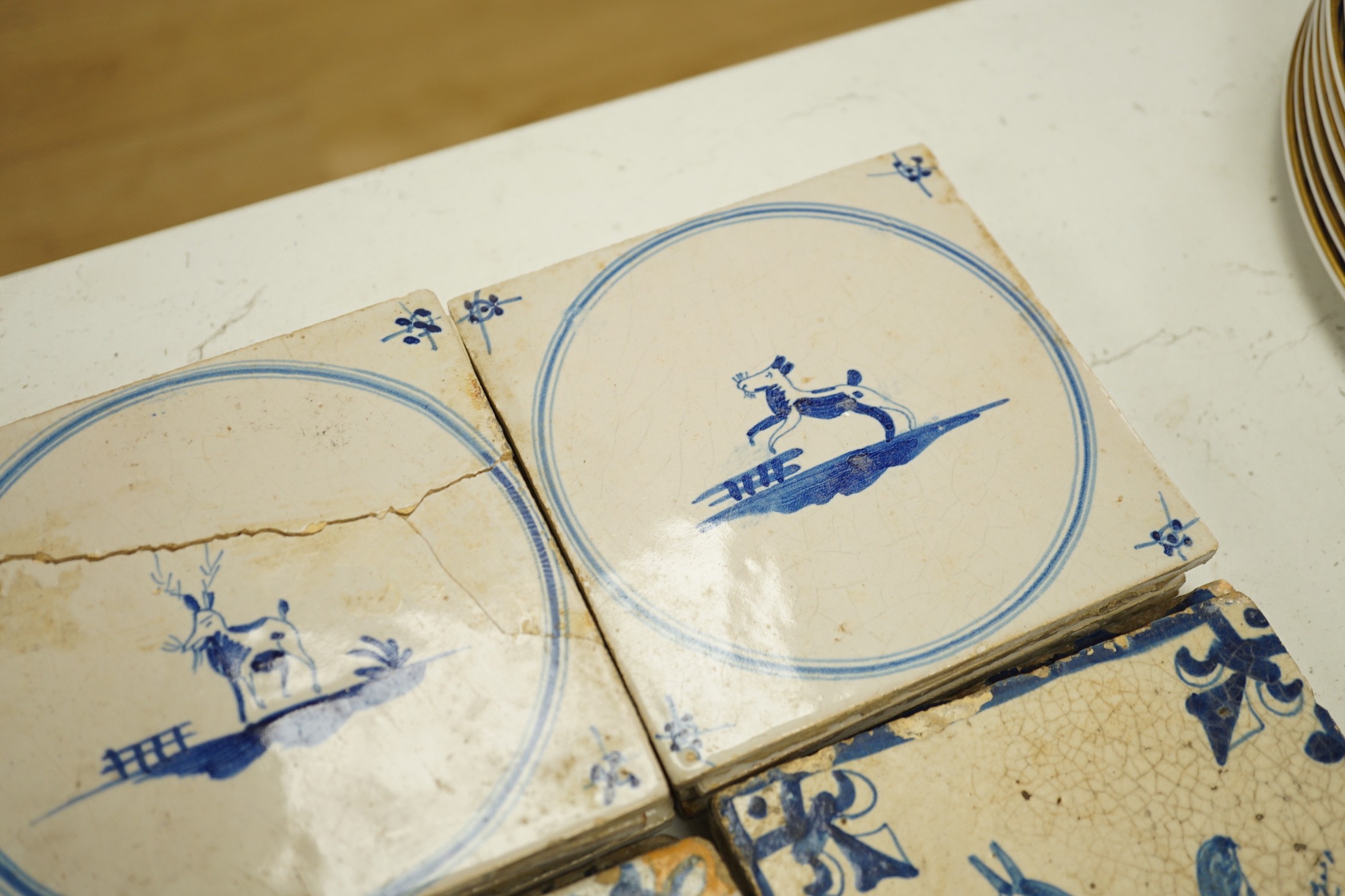 Four 18th century Delft tiles and nine 19th-century Delft blue and white animal tiles(13)